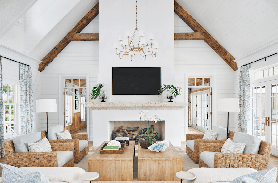 Living room with central fireplace in Island Breeze, a 2023 BALA winner.
