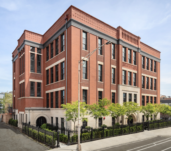 alt="Exterior aerial view of Peabody School Apartments, an adaptive reuse project in Chicago and 2023 BALA winner"