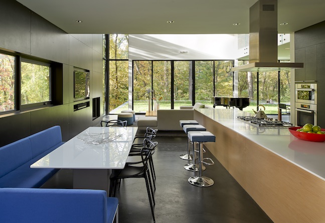 Kitchen and breakfast room of modern house, big glass, transitions to living room