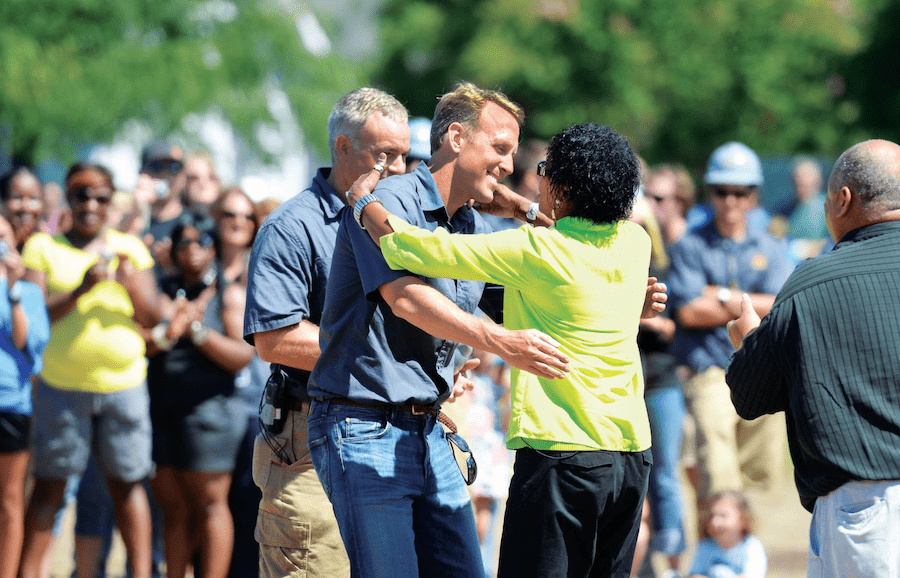 2023 Builder of the Year Schell Brothers' CEO Chris Schell gives a hug