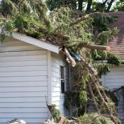 House with roof damage after a storm