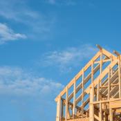 Framed home against blue sky