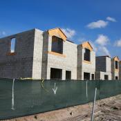 A row of townhomes sit under construction 