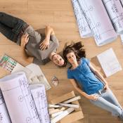 Homeowners laying on floor of home