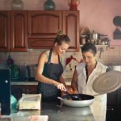Mother and daughter cooking in home