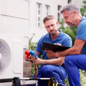 Technicians checking HVAC system faults