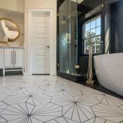 Updated bathroom with new, patterned tile flooring and plenty of natural light