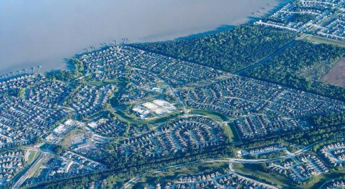 Aerial view of residential community on large body of water