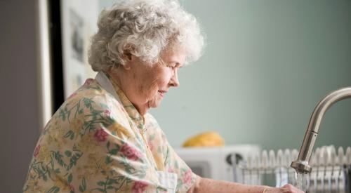 Elderly woman on the sink