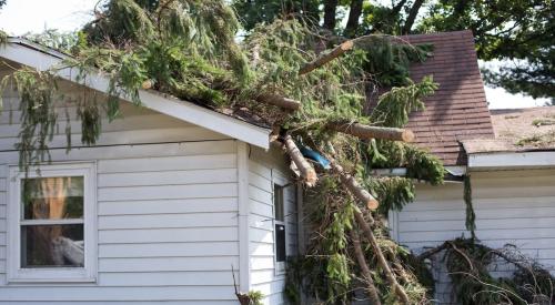 House with roof damage after a storm