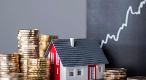 Stacks of gold coins sit around a model home, indicating high housing costs.