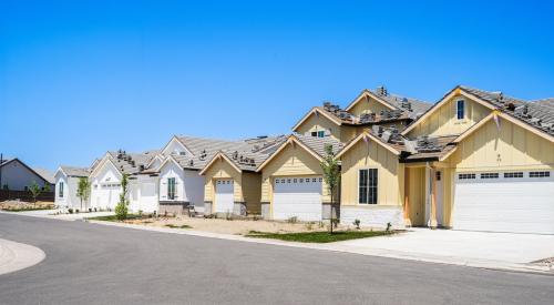 A row of homes sits under construction