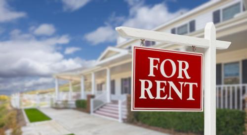 A single-family rental community with a "For Rent" sign in the front yard