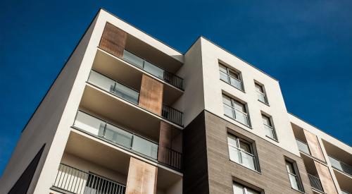 Apartment building against a blue sky