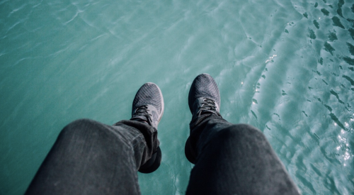 feet suspended over water