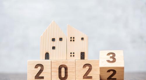 Wooden houses and number blocks flipping from 2022 to 2023