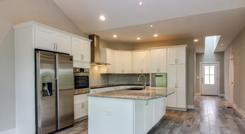 Pictured: A home by Addison Homes with a modern kitchen with Energy Star appliances