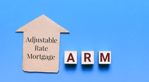 Adjustable rate mortgage on small cardboard house with letters 'a' 'r' and 'm' against blue background