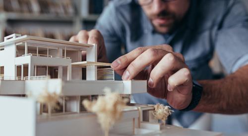 Architect working on model home