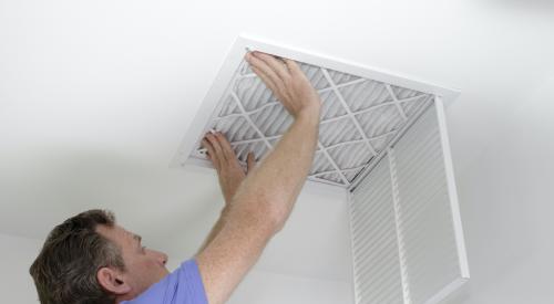 Person installing air filter