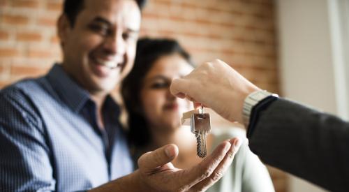 Homebuyers getting keys to new home