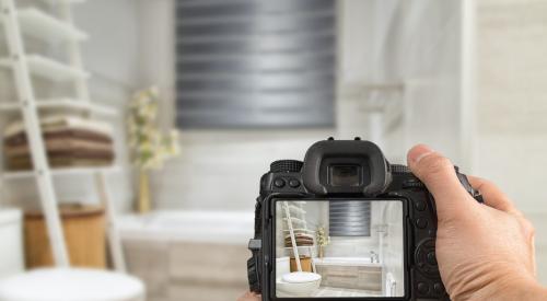 Person taking photo of bathroom