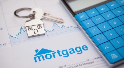 Empty mortgage application with home key and calculator 