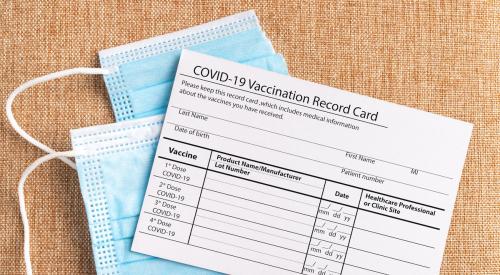 COVID-19 vaccine card and masks
