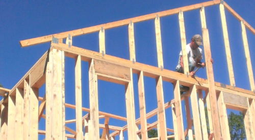 construction worker and timber house framing