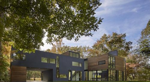 Exterior shot of modern custom home in Maryland; wood, stucco and fiber cement siding