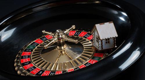 Toy house on a roulette wheel 
