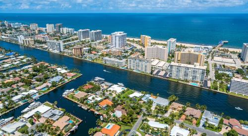 Miami city skyline and residential houses along the Florida coastline