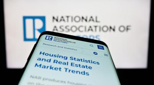 National Association of Realtors webpage on computer and phone