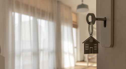 Rental home key in door