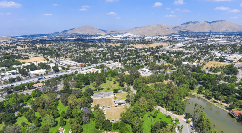 Aerial view of Riverside, California, with mountains in the distance 