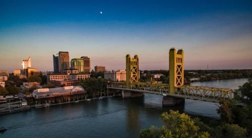 Sacramento bridge and city skyline at sunset