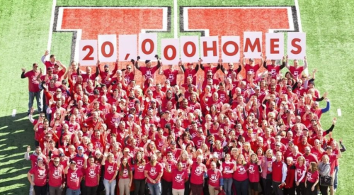 Aerial_of_Ivory_Homes_employees_with_20,000_homes_sign