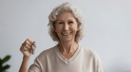 Senior citizen holds keys to new, affordable home