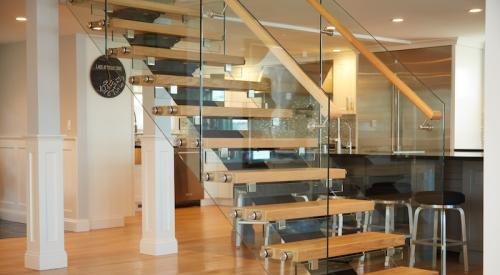 Flight by Viewrail floating stairs are customizable with steel stringers, 15 species of wood treads with thicknesses up to 4 inches, unobtrusive brackets, and railings of cable, glass (shown), or stainless steel. 