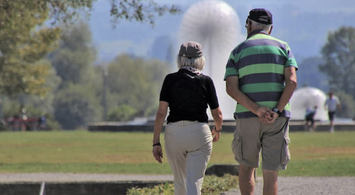 Senior couple out walking for exercise