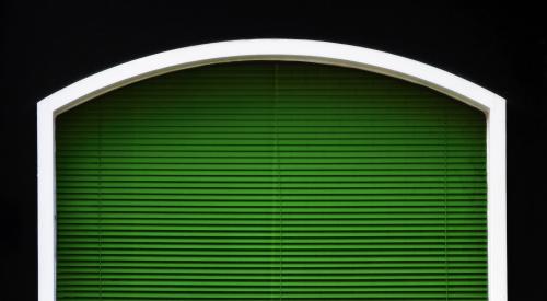 Green blinds in a transom window
