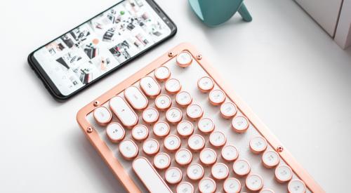 Keyboard, smartphone on desk