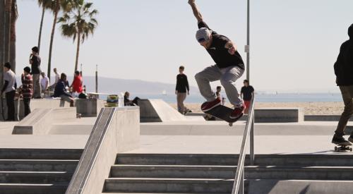 Skater skating down railing