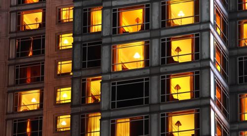 Individual apartment units lit up at night