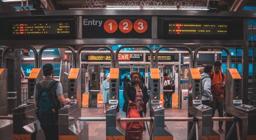 NYC subway passing through turnstiles