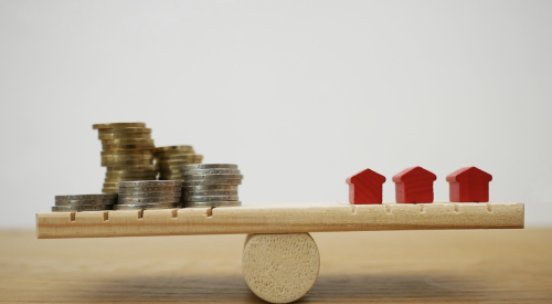 balancing act on see-saw to balance homes and money lending for builders