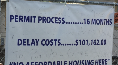 Banner about no affordable housing because costs are up due to regulations