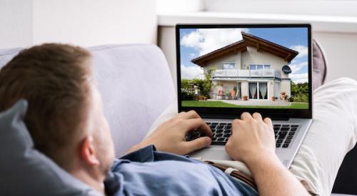 man looking at home on laptop for buying home online