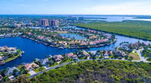 Aerial view of houses in sunny Cape Coral, Fla., where new listings are up