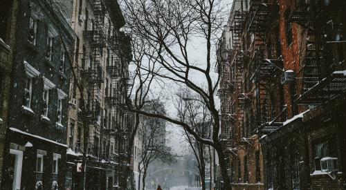 Snow falling on a street